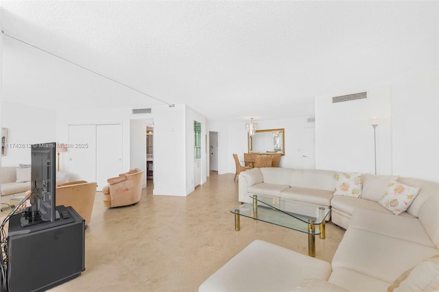 living room with a textured ceiling