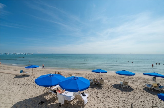 property view of water featuring a beach view