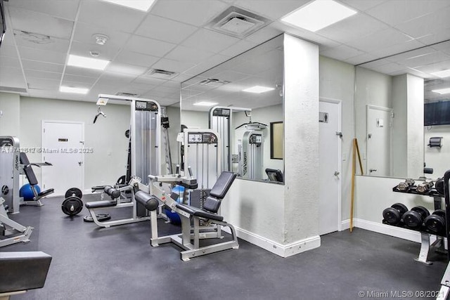 gym featuring a drop ceiling