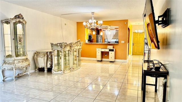 481 Ives Dairy Rd Unit 301-4, Miami, FL 33179 - dining area with a chandelier, light tile patterned floors, and a textured ceiling