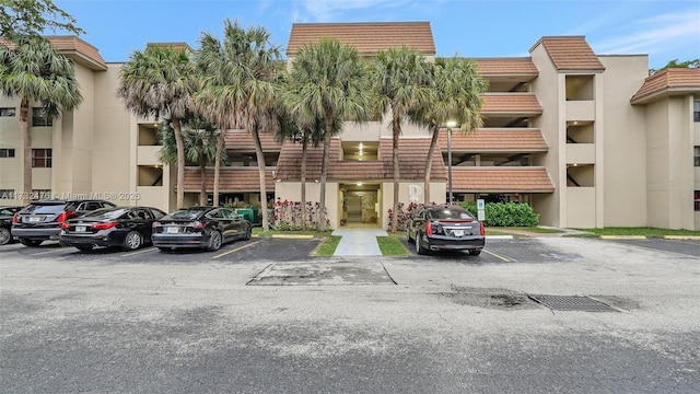 view of property featuring uncovered parking