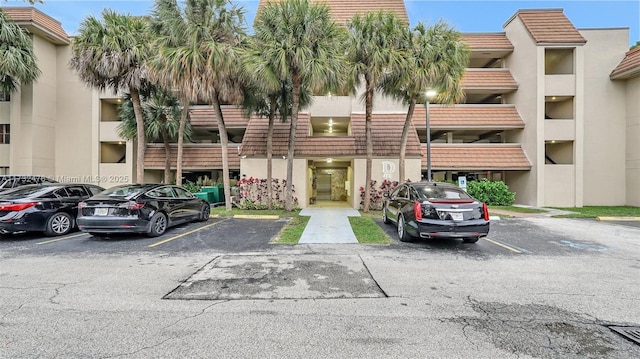 481 Ives Dairy Rd Unit 105-4, Miami, FL 33179 - view of property with uncovered parking