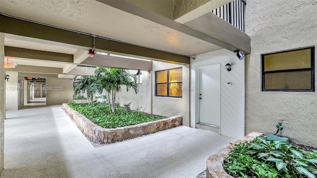 481 Ives Dairy Rd Unit 105-4, Miami, FL 33179 - view of exterior entry featuring stucco siding