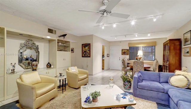 481 Ives Dairy Rd Unit 105-4, Miami, FL 33179 - living area featuring ceiling fan, track lighting, baseboards, light tile patterned floors, and visible vents