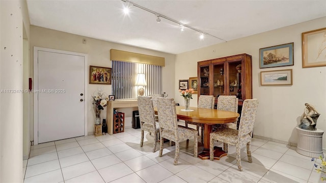 481 Ives Dairy Rd Unit 105-4, Miami, FL 33179 - dining space featuring light tile patterned flooring and track lighting