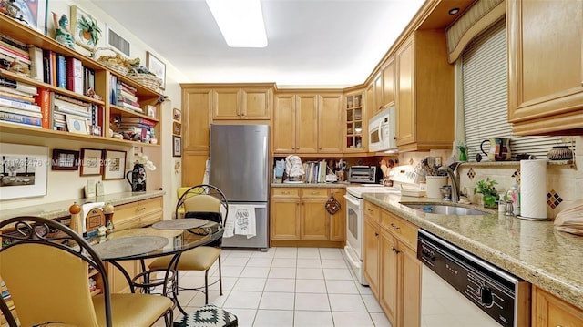 481 Ives Dairy Rd Unit 105-4, Miami, FL 33179 - kitchen featuring a sink, light tile patterned floors, light stone counters, glass insert cabinets, and white appliances