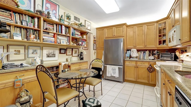 481 Ives Dairy Rd Unit 105-4, Miami, FL 33179 - kitchen featuring light stone counters, white appliances, light tile patterned floors, a toaster, and glass insert cabinets