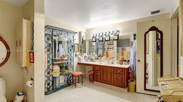 bathroom featuring visible vents and vanity