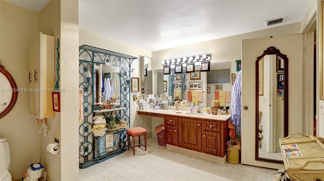 481 Ives Dairy Rd Unit 105-4, Miami, FL 33179 - full bath with tile patterned floors, vanity, toilet, and visible vents