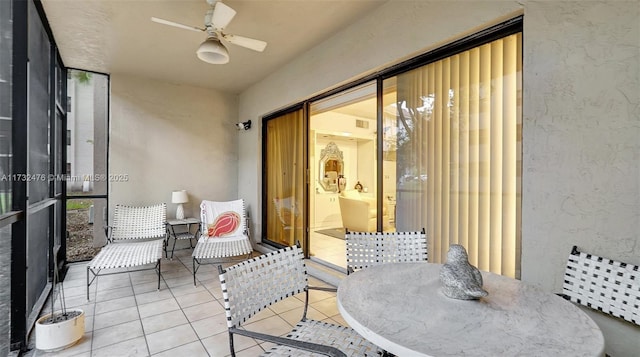 sunroom with ceiling fan and visible vents