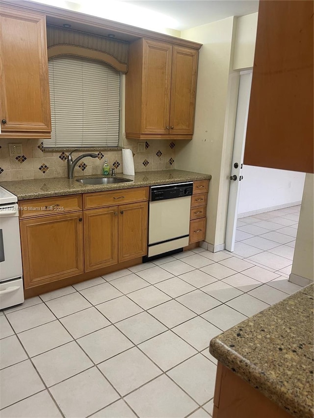 481 Ives Dairy Rd Unit 105-4, Miami, FL 33179 - kitchen with white appliances, backsplash, stone countertops, and a sink