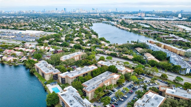 bird's eye view featuring a view of city and a water view