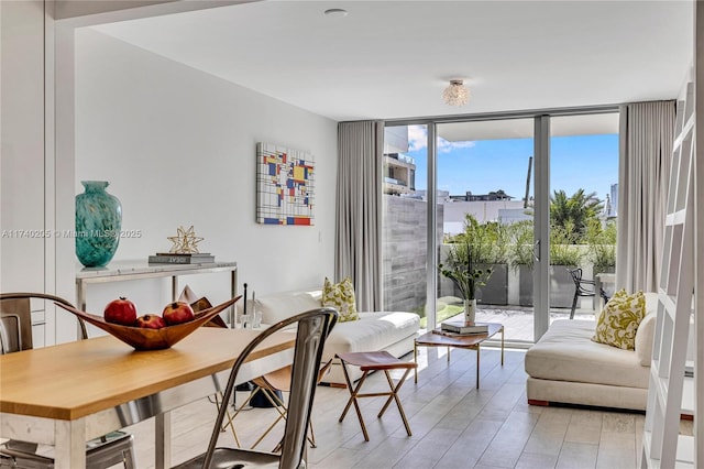 interior space featuring floor to ceiling windows and light hardwood / wood-style flooring