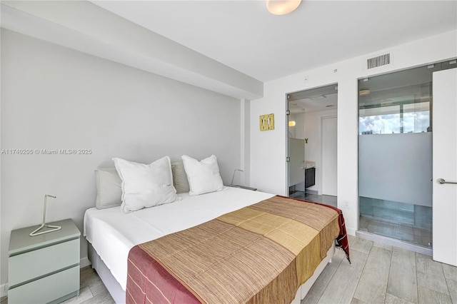 bedroom featuring hardwood / wood-style floors