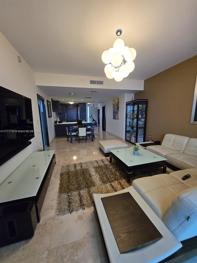 living room featuring a notable chandelier