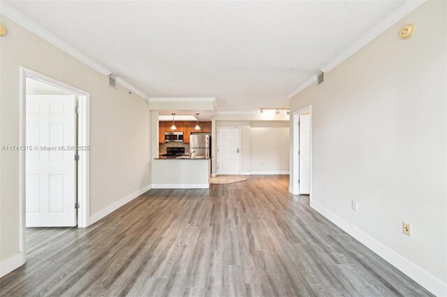 2000 N Bayshore Dr Unit 304, Miami, FL 33137 - unfurnished living room featuring wood finished floors, crown molding, and baseboards