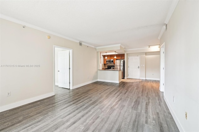 2000 N Bayshore Dr Unit 304, Miami, FL 33137 - unfurnished living room with wood finished floors, ornamental molding, and baseboards