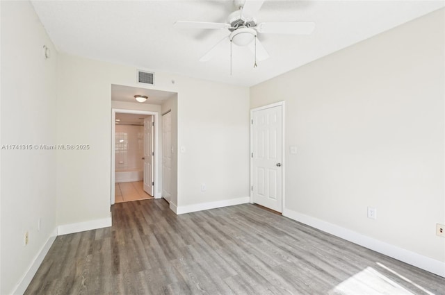 2000 N Bayshore Dr Unit 304, Miami, FL 33137 - unfurnished room featuring wood finished floors, baseboards, and a ceiling fan