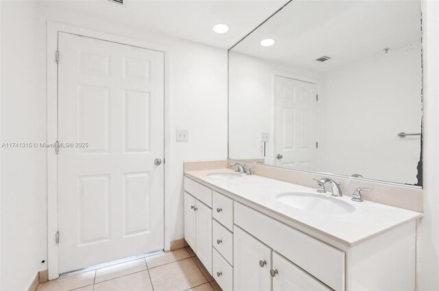 2000 N Bayshore Dr Unit 304, Miami, FL 33137 - bathroom with double vanity, tile patterned floors, baseboards, and recessed lighting