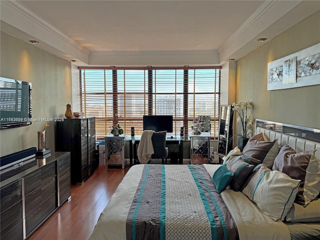 bedroom featuring wood-type flooring and ornamental molding