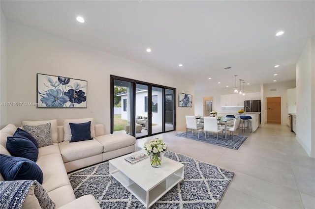 living room with recessed lighting and visible vents