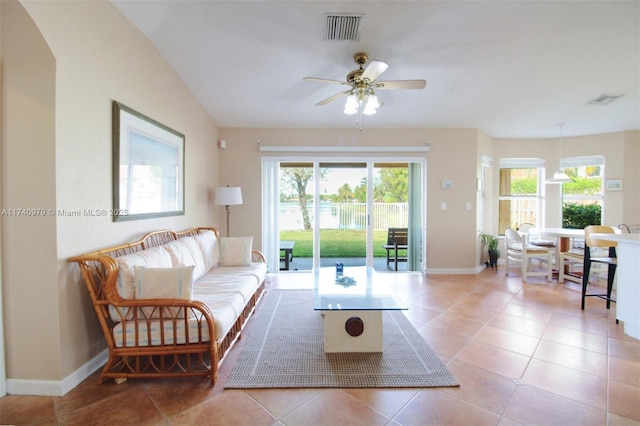 12239 SW 140th St, Miami, FL 33186 - tiled living room featuring a ceiling fan, baseboards, arched walkways, and a water view
