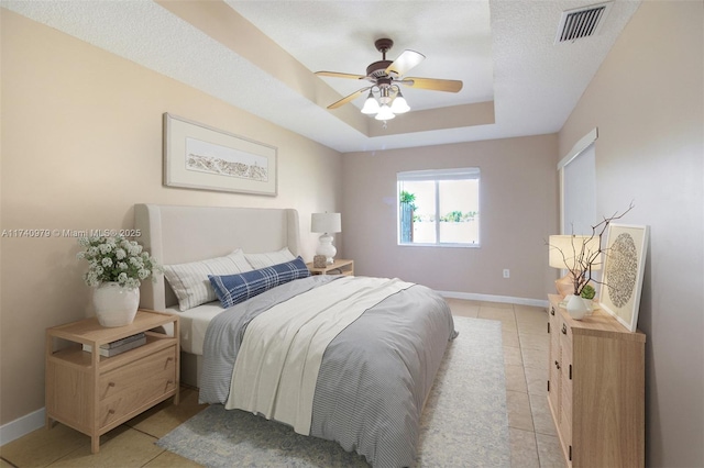 12239 SW 140th St, Miami, FL 33186 - bedroom with a raised ceiling, baseboards, light tile patterned flooring, and a ceiling fan