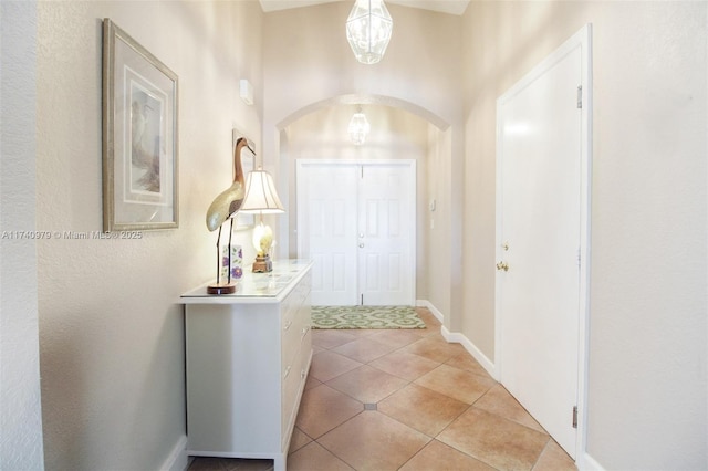 12239 SW 140th St, Miami, FL 33186 - foyer entrance featuring arched walkways, light tile patterned floors, and baseboards
