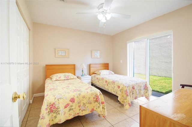 12239 SW 140th St, Miami, FL 33186 - bedroom with access to exterior, light tile patterned floors, a ceiling fan, and baseboards