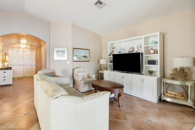 12239 SW 140th St, Miami, FL 33186 - living room with arched walkways, light tile patterned floors, and lofted ceiling