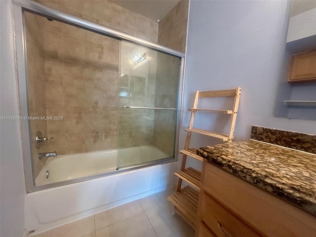 bathroom with shower / bath combination with glass door, vanity, and tile patterned floors