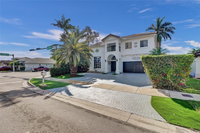 mediterranean / spanish-style house featuring a garage