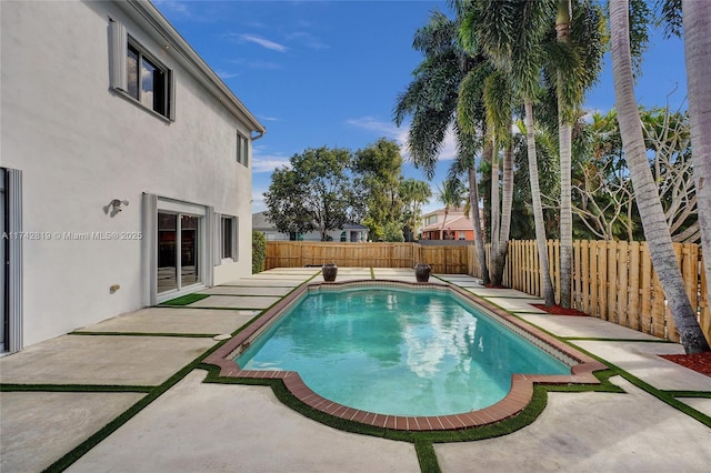 view of swimming pool with a patio area