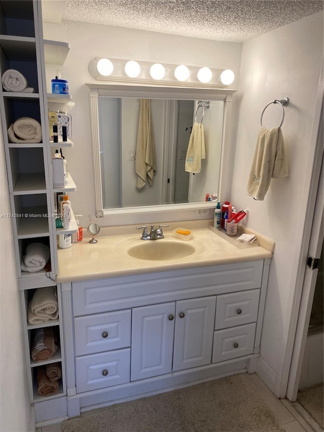 bathroom featuring vanity and a textured ceiling