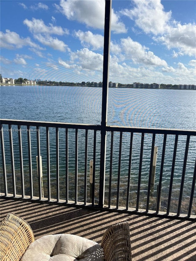 balcony featuring a water view