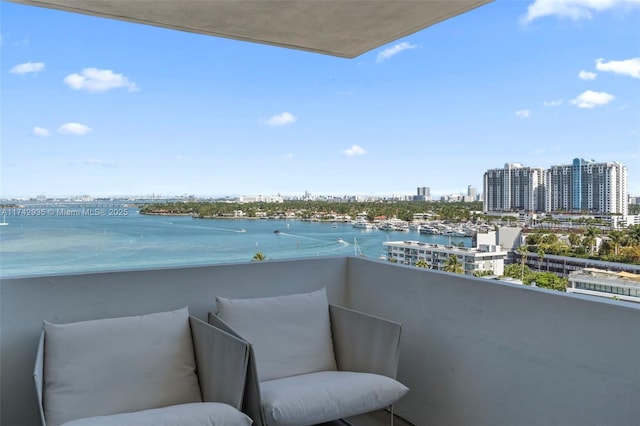 balcony featuring a water view