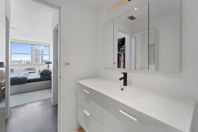 bathroom with vanity and concrete floors