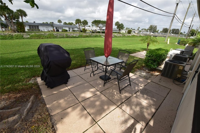 view of patio with grilling area and central air condition unit