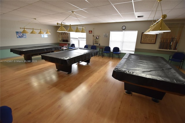 rec room featuring a drop ceiling, hardwood / wood-style floors, and billiards