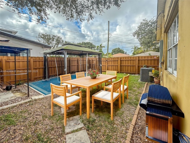 view of patio / terrace with a gazebo and central air condition unit