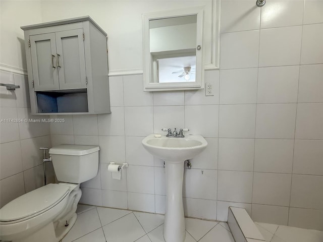 bathroom with toilet and tile patterned flooring