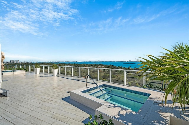 view of pool featuring a water view