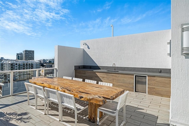 view of patio / terrace with beverage cooler and a wet bar