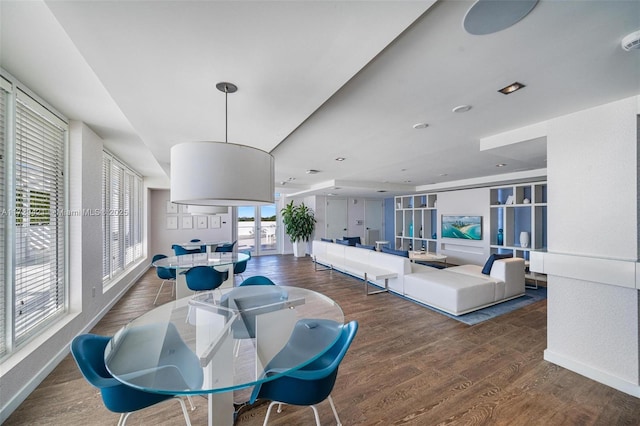 dining space with dark hardwood / wood-style flooring