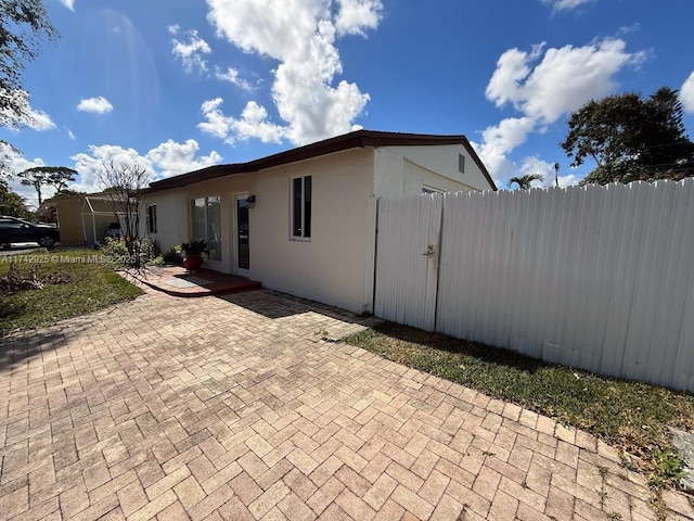 view of home's exterior with a patio area