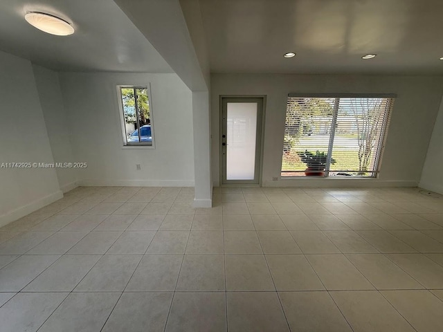 unfurnished room featuring light tile patterned floors