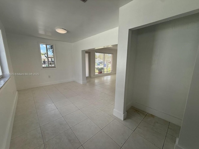 spare room with light tile patterned floors