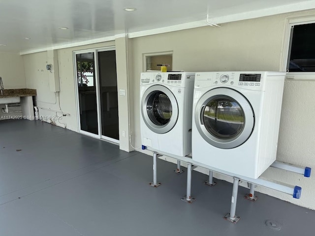 laundry area with washing machine and clothes dryer