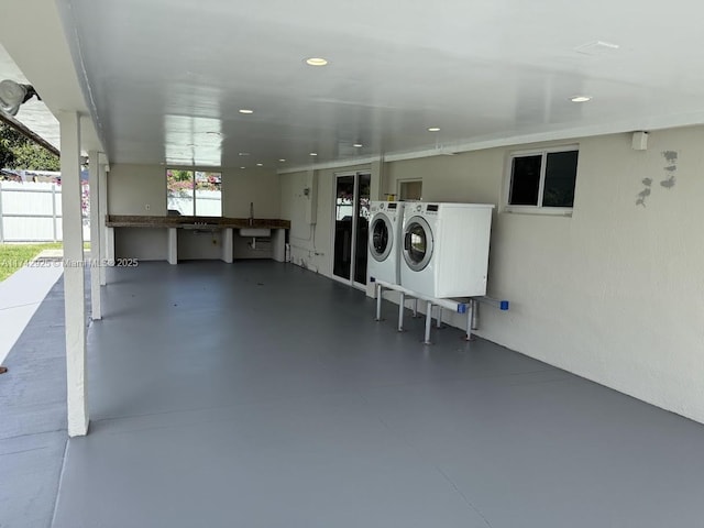 clothes washing area with separate washer and dryer