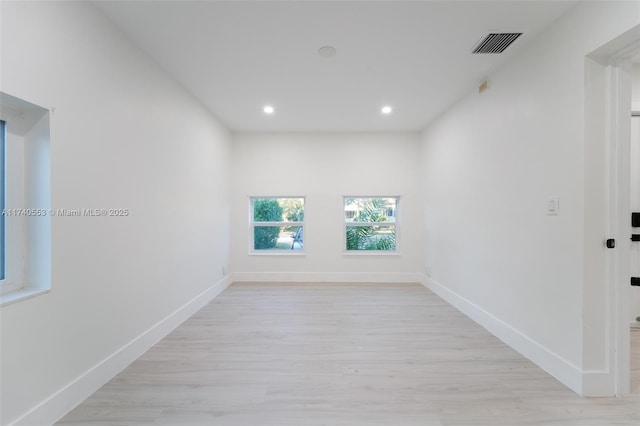 spare room with light wood-type flooring